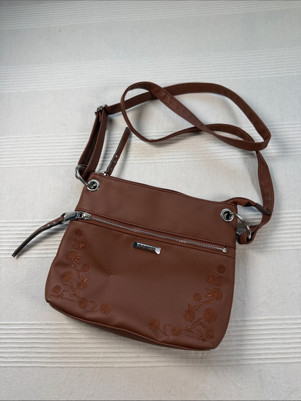 Rosetti Brown Floral-Embossed Crossbody Bag